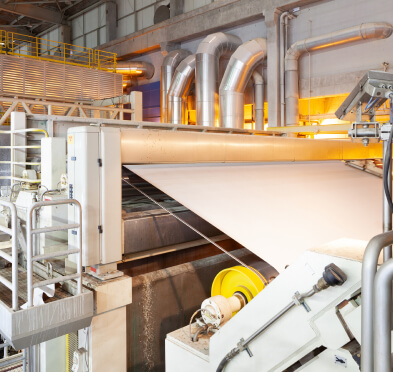 White conveyor belt in large factory with pipes and platforms