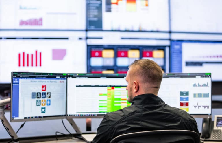Man viewing monitors looking to his left