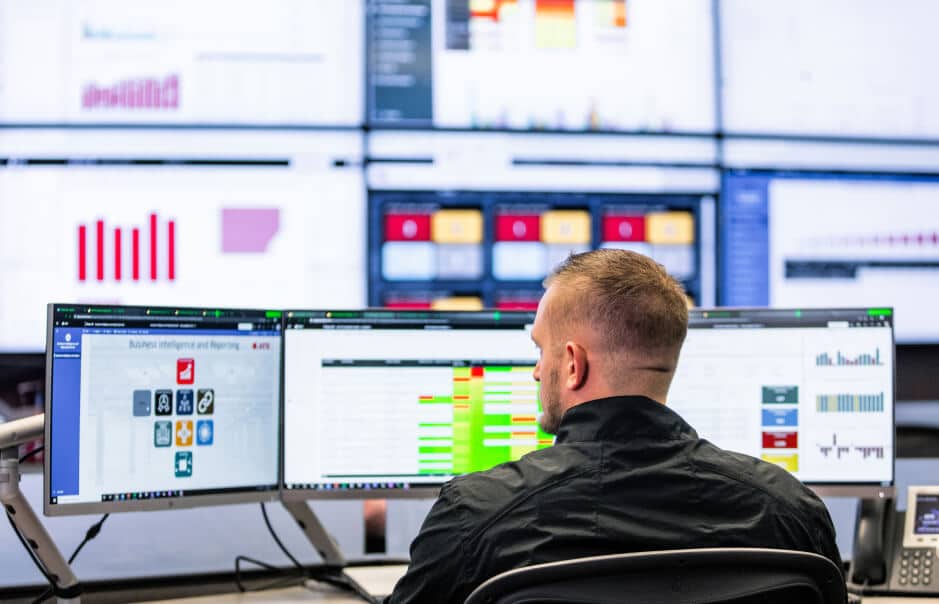 Man viewing monitors looking to his left