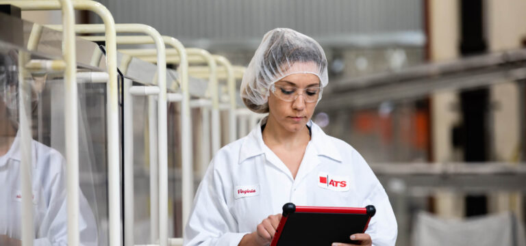 Woman in hairnet looking at iPad