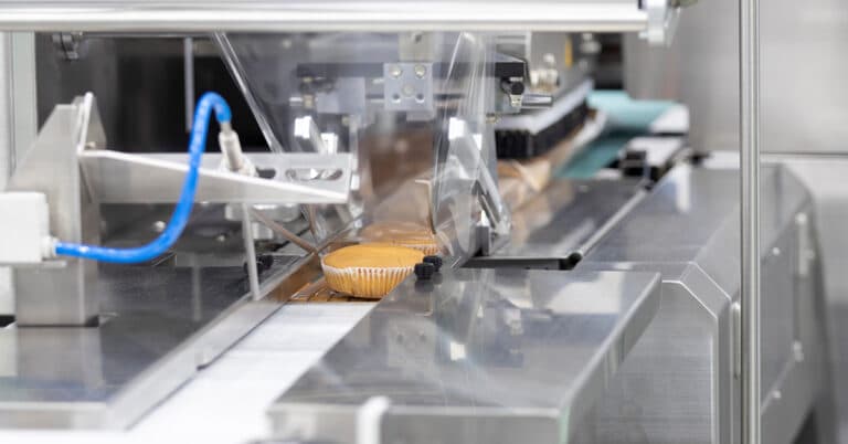 Cupcake packing machine in CPG facility