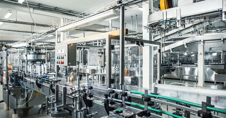 Industrial factory interior with equipment, conveyor line and steel tools