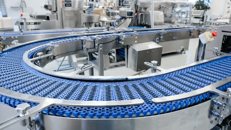 Empty modern conveyor belt of production line, part of industrial equipment in factory plant.