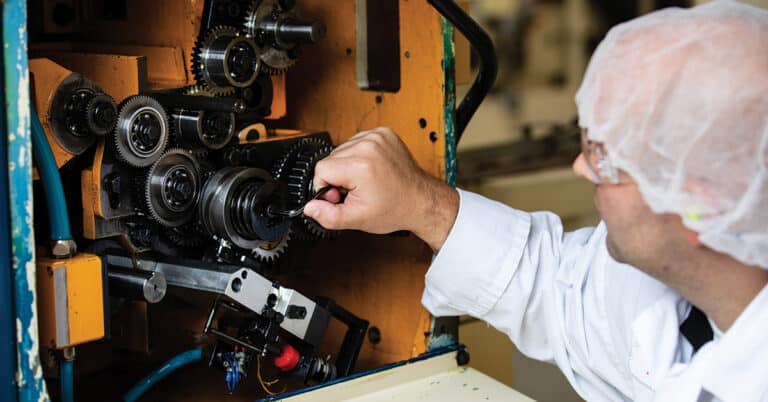 ATS maintenance technician performing maintenance on CPG equipment.