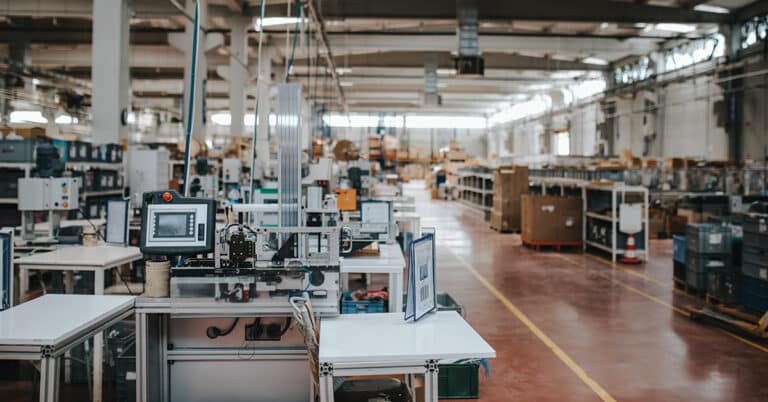 Aerial view of manufacturing plant with injection molding CNC machine.