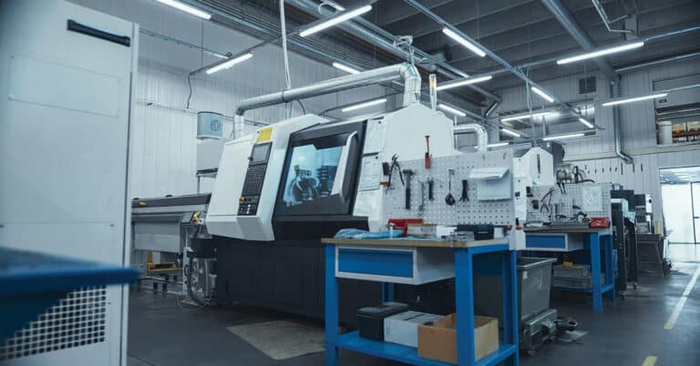 An automated CNC milling machine at a modern industrial facility.