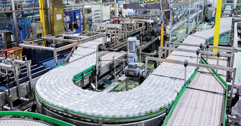 Beverage cans on conveyor belt.
