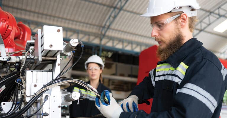 Electrical engineer with the mission of installing a robot arm electrical system.