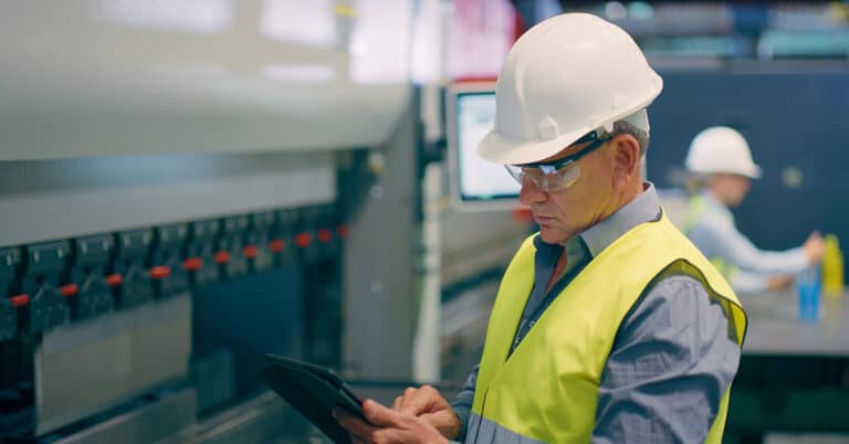 Planning man, tablet and manufacturing in factory for machinery innovation, workshop or industrial production thinking.