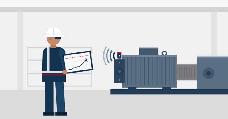 Technician reviewing machine health monitoring data from motor.