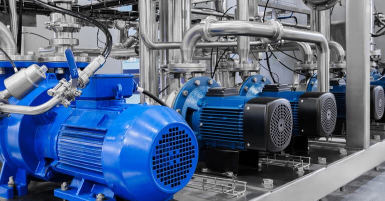 Industrial piping system in monochrome. Stainless steel pipes form complex network.